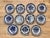 Rare set of 12 Delft tin-glazed blue and white soup plates, 18th Century. Each centered by a large floral design or...
