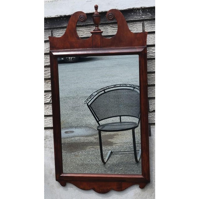 Beautiful antique American Chippendale Revival hall mirror, circa 1900–1920. Crafted in solid maple with a rich mahogany...