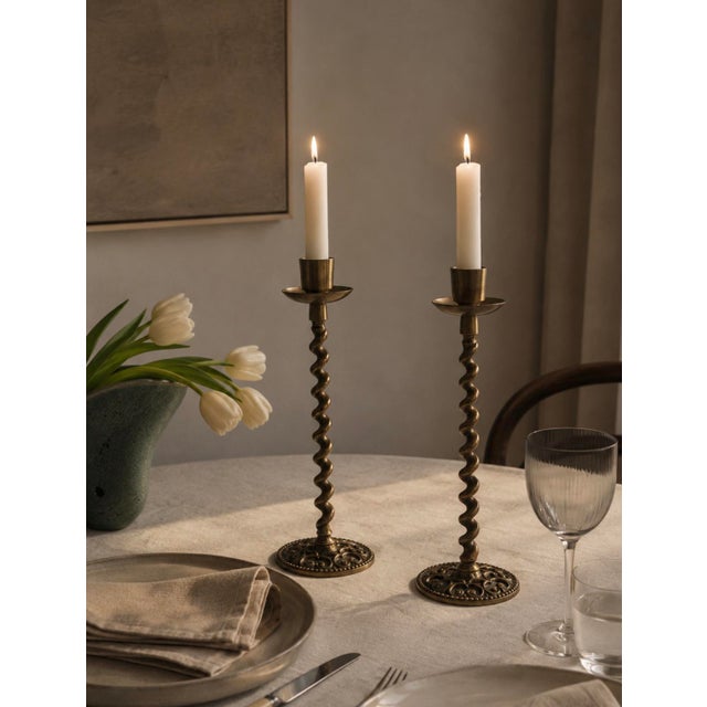 A gorgeous matched pair of vintage Israeli brass barley twist candlesticks — marked "Made in Israel" on the pierced base —...