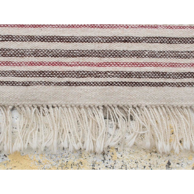 This carpet is made entirely by hand on an ancient vertical frame, with the traditional weaving technique. Both the warp...
