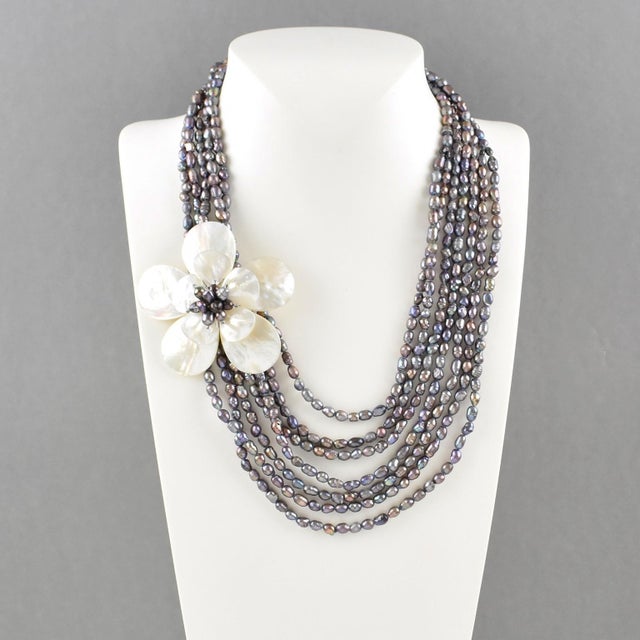 Elevate your private jewelry collection with this exquisite multi-strand freshwater pearl choker, designed to captivate. A...