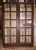 Antique Chestnut 10 Light French Doors With Leaded Glass Panes - A Pair For Sale In New York - Image 6 of 7
