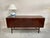 A refined example of danish modern design by ole wanscher, this three-door low cabinet is part of the celebrated...