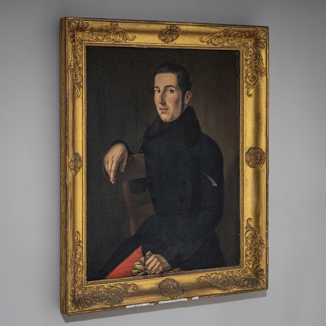Portrait of a young man from the Biedermeier period, depicted with dark hair and dark attire. Oil on canvas. The surface...
