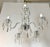 This mid 20th century chandelier is constructed with a polished nickel finished frame and features five radiating glass...