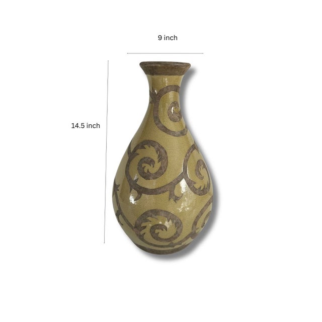 This fired clay pottery vase has nice contrast between the raw, earthy clay swirls and the shiny, polished moss green...