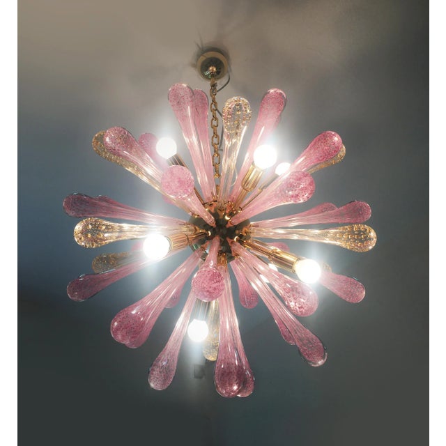 Impressive murano glass sputnik chandelier with gold and pink with air drops the most pink drops are random dispositions,...