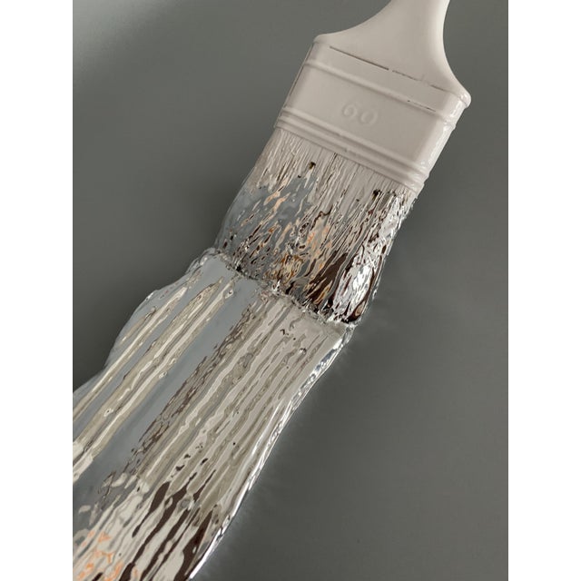 Santicri Silver Brush, 2025 resin sculpture Edition of 100 copies Can be hung or placed. Dimensions: 40 x 7 x 2cm This...