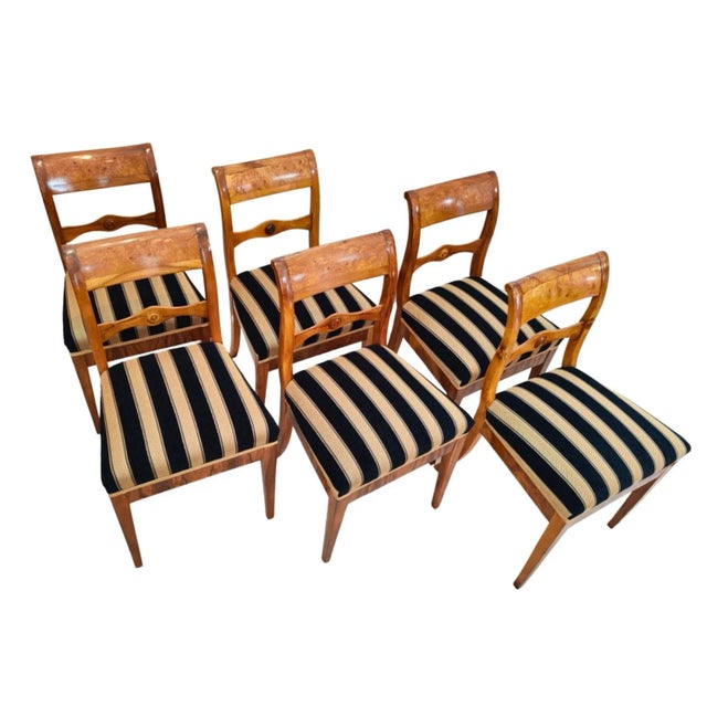 A set of six chairs, classic original Biedermeier, solid walnut wood. The backrests have a decorative ash wood inlay....