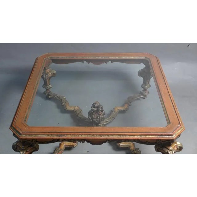 Italian wood and gilt square coffee table with large glass insert. Silver gilt and painted carved wood.
