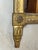 An elegant Louis XVI period mirror in carved and gilded wood, surmounted by an openwork pediment depicting a bird...