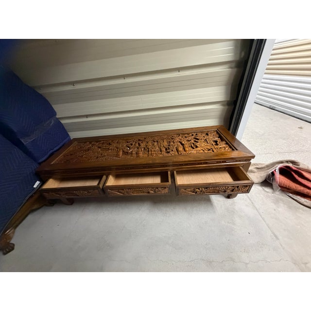 Breathtaking and highly detailed, this vintage South East Asian coffee table features a masterfully hand-carved top panel...