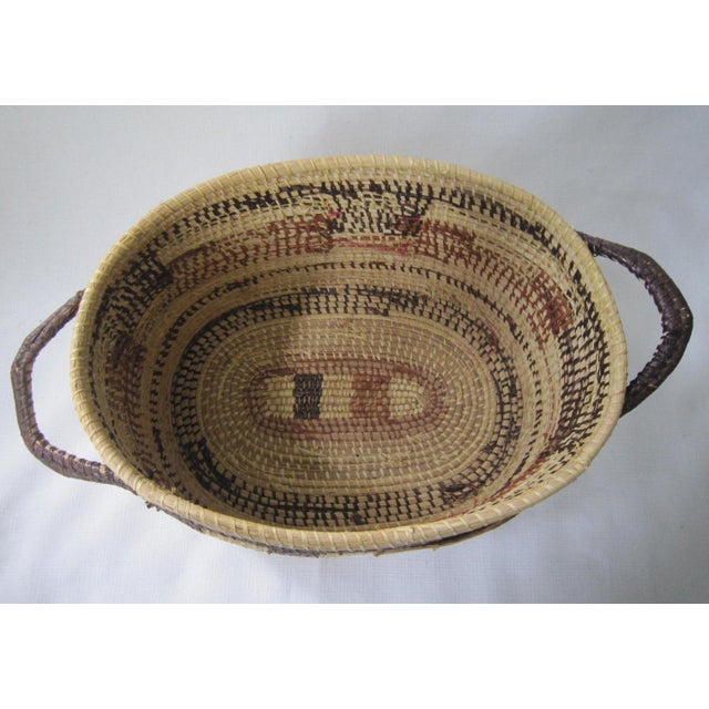 Pristine 60's Era Basket from Panama with artist's label. Made by a woman of the Wounaan Indian tribe, It measures 16"L x...