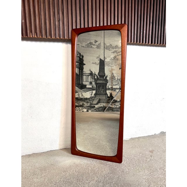 This large wall mirror was manufactured during the late 1950s in Germany. Its elegant frame features rounded edges and is...