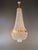 A large and exceptionally tall crystal chandelier in the classic tent-and-bag design. Numerous strands of clear, faceted...