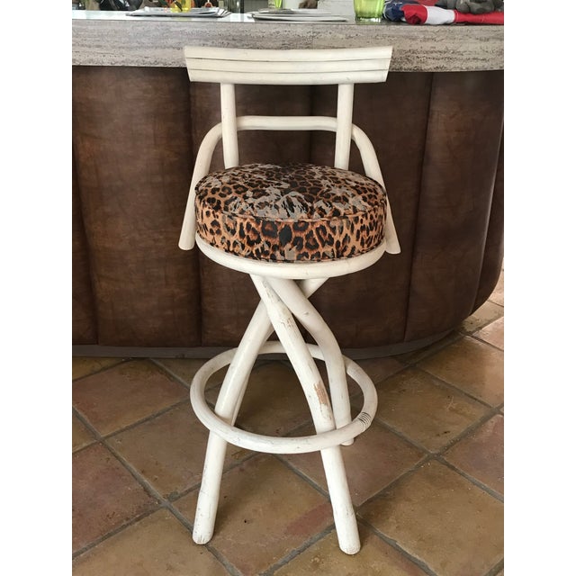 Set of 4 mid Century barstools with leopard print upholstery. Has wear on surface.