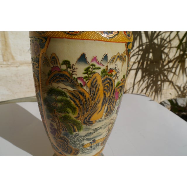 Exquisite Vintage Royal Satsuma Vase with Mountain Scenes on two panels & Florals all around. 12" Tall. There is delicate...