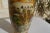 Exquisite Vintage Royal Satsuma Vase with Mountain Scenes on two panels & Florals all around. 12" Tall. There is delicate...