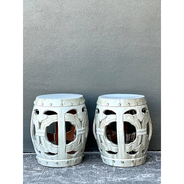 This elegant pair of vintage garden stools brings a timeless Chinoiserie aesthetic to any sophisticated interior. Crafted...