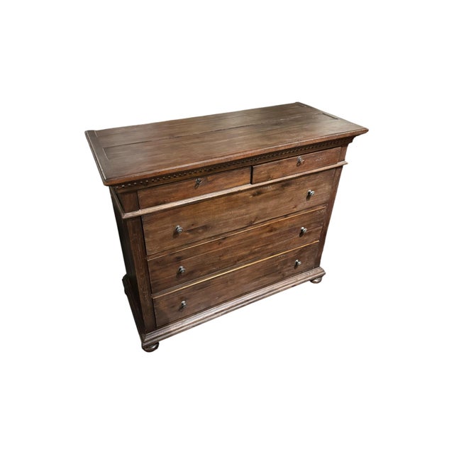A substantial Restoration Hardware dresser crafted in rich, warm-toned wood with a timeless, understated design. This...