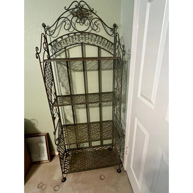 This is a large French baker's rack made of iron with 4 shelves. It measures 71"H x 27"W x 13"D. Excellent quality &...