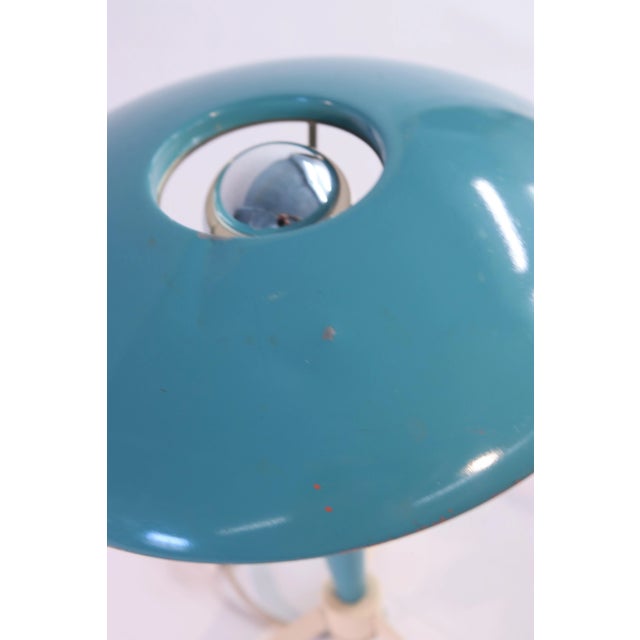 A stylish mid century modern table lamp, made by the Dutch brand Philips, designed by Louis Kalff. The name of the model...