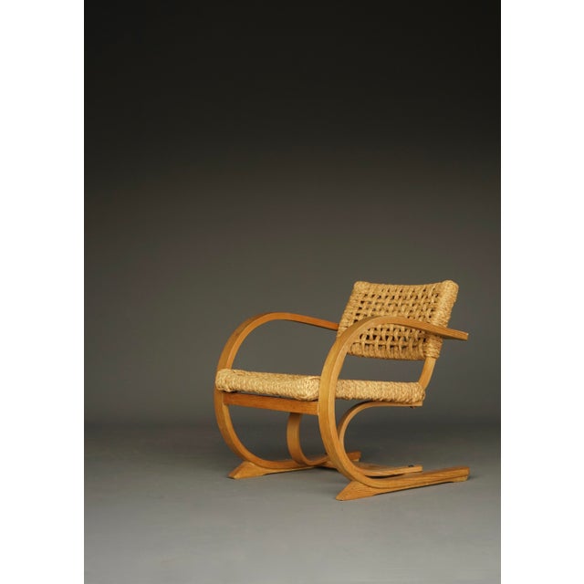 Oak framed cantilever chair with thick rope woven seat and back. 1930s. My Home/ The Hague. Comfortable chair, designed by...