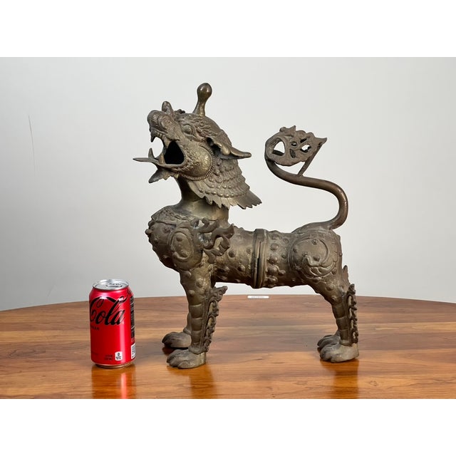 This striking vintage cast brass Pixiu figure has a wonderfully dramatic presence, combining the powerful symbolism of the...