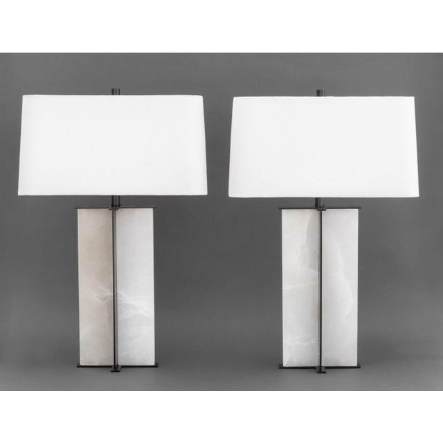 Pair of French Arteriors Lyon Table Lamps, alabaster and black patinated metal each with rectangular white fabric shade....