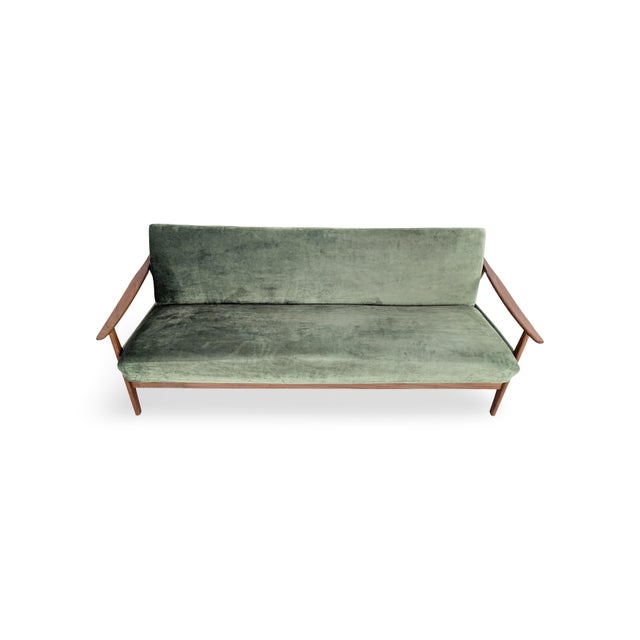 We are offering a beautiful vintage three-seater sofa bed from the 1960s for sale. This sofa, which embodies the Mid-...