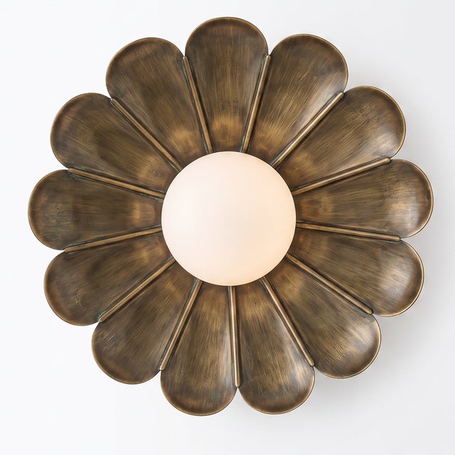 Bring sculptural elegance and warm character to your interior with this handcrafted floral flush-mount ceiling light by...