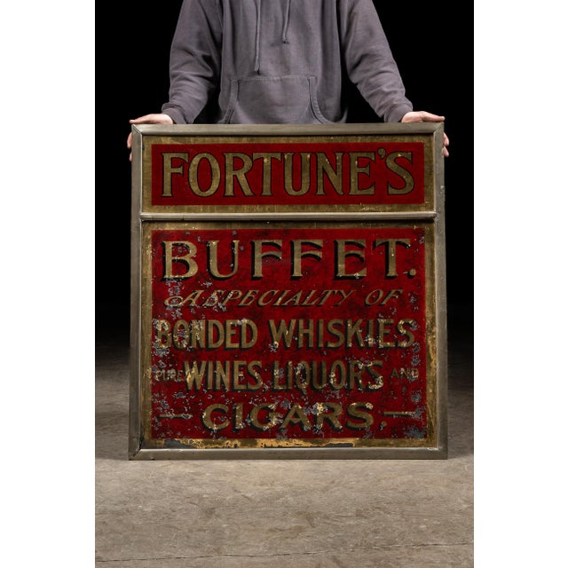 Antique reverse-painted storefront sign. This piece was for a shop that specialized in alcoholic and tobacco goods....