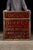 Antique reverse-painted storefront sign. This piece was for a shop that specialized in alcoholic and tobacco goods....