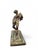 Charming 19th-century bronze sculpture depicting a satyr serving wine, inspired by an ancient model discovered in Pompeii....