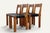 Set of four S24 model chairs, designed by Pierre Chapo in 1967, combining a solid elm frame with a black leather seat....