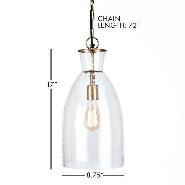 In a classic mix of warm brass and seeded glass, the Belle pendant is a traditional fixture. Over an island, in an entry...
