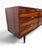 A striking Mid-Century Danish Modern rosewood dresser, circa 1960s, showcasing dramatic grain patterns, rich coloration,...