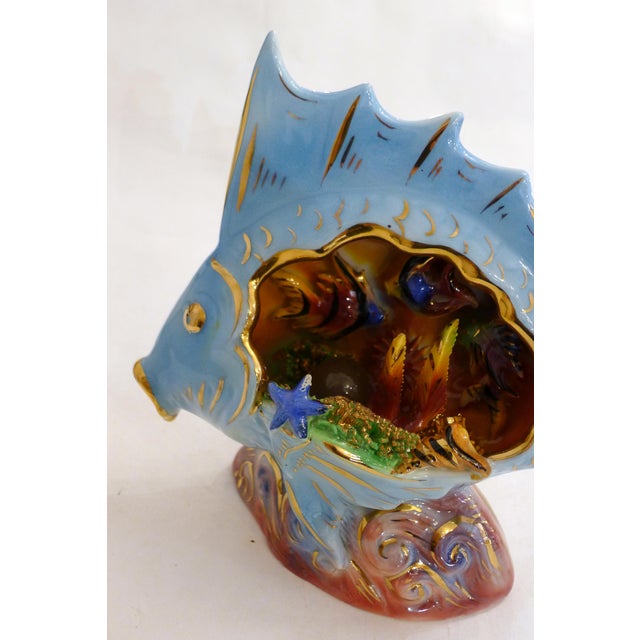 Zoomorphic nightlight, slipware fish: oval base, large light blue and gold tropical fish, hollow interior housing the...