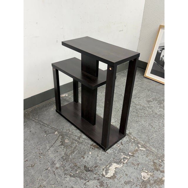 Design Plus Gallery presents the Modern Tiered Geometric Side Table. It comes in espresso toned wood veneer. This piece...