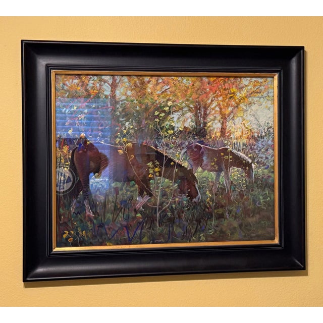 In "Grazers," two horses peacefully graze amidst a vibrant landscape illuminated by autumn hues. The use of soft pastels...