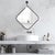 The matte black frame is crafted to appear as if it's delicately being peeled off the surface of the mirror, leaving the...