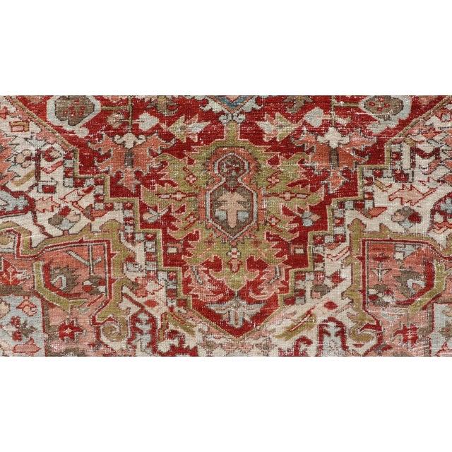 Textile Early 20th Century Antique Persian Heriz Rug With Geometric Medallion Design in Red & Soft Colors For Sale - Image 7 of 12