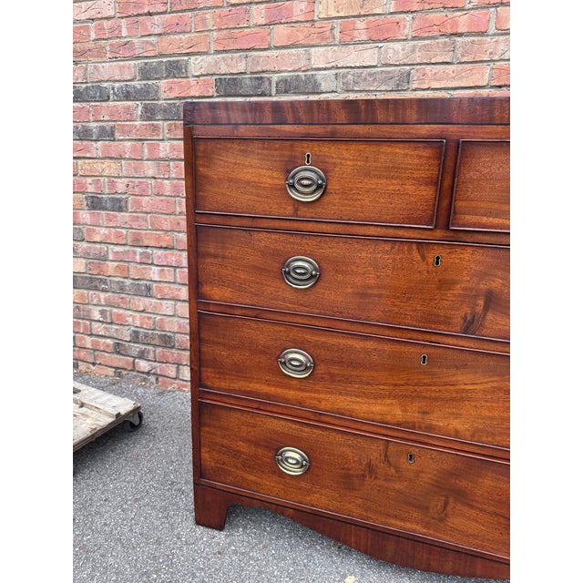 This 19th century English Chest of Drawers is a beautifully designed piece of furniture, featuring a caddy top tastefully...