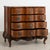 This antique rococo large oak chest of drawers features a serpentine front, brass hardware pulls and is raised on a carved...