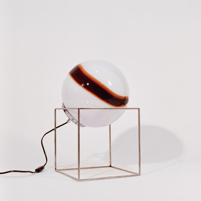 Sculptural murano glass table or floor lamp by Venini, 1970s. Body formed by a chrome-plated silver metal cube that, as a...