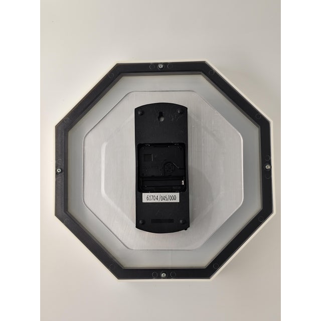 Vintage Commodore White Quartz Wall Clock, 1990s Octagonal Plastic/Glass This piece has an attribution mark, I am sure...