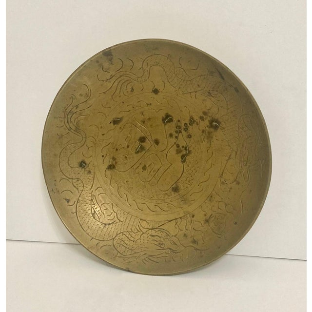 Incised dragon motif deep plate, shallow bowl. The piece is marked China on bottom. Selling as found in its natural patina...