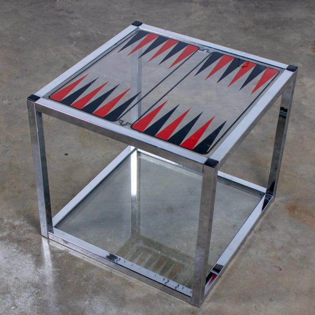 Fabulous vintage Mid-Century Modern game end or side table composed of a cube shaped chrome square tube frame with black...