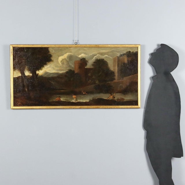 Oil on canvas. 18th-century Italian school. In a hilly, green landscape, stand the turreted walls of a building...