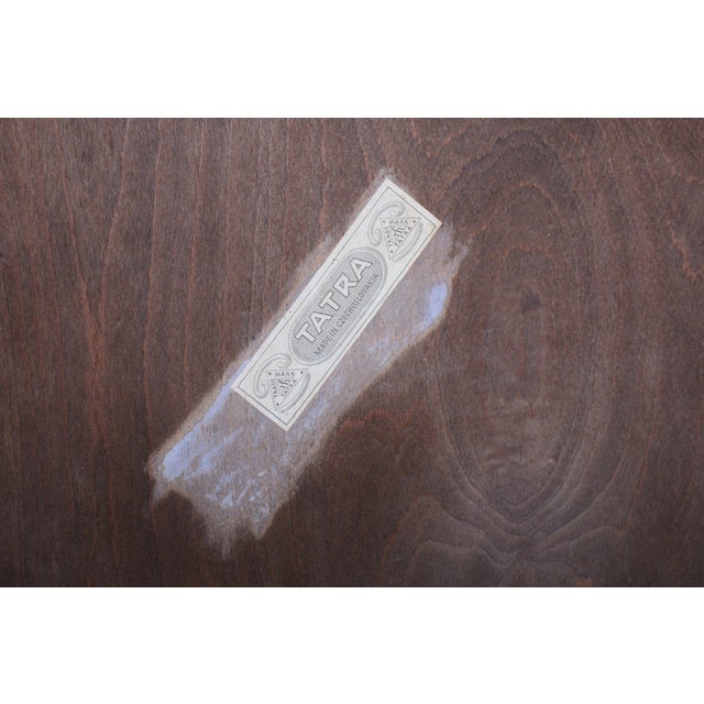 This elegant art deco armchair comes from czechoslovakia from the first half of the 20th century and was manufactured by...